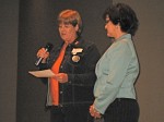 Jana Rowland accepts the Jack Renner Award from OSTA President Suzanne Spradling